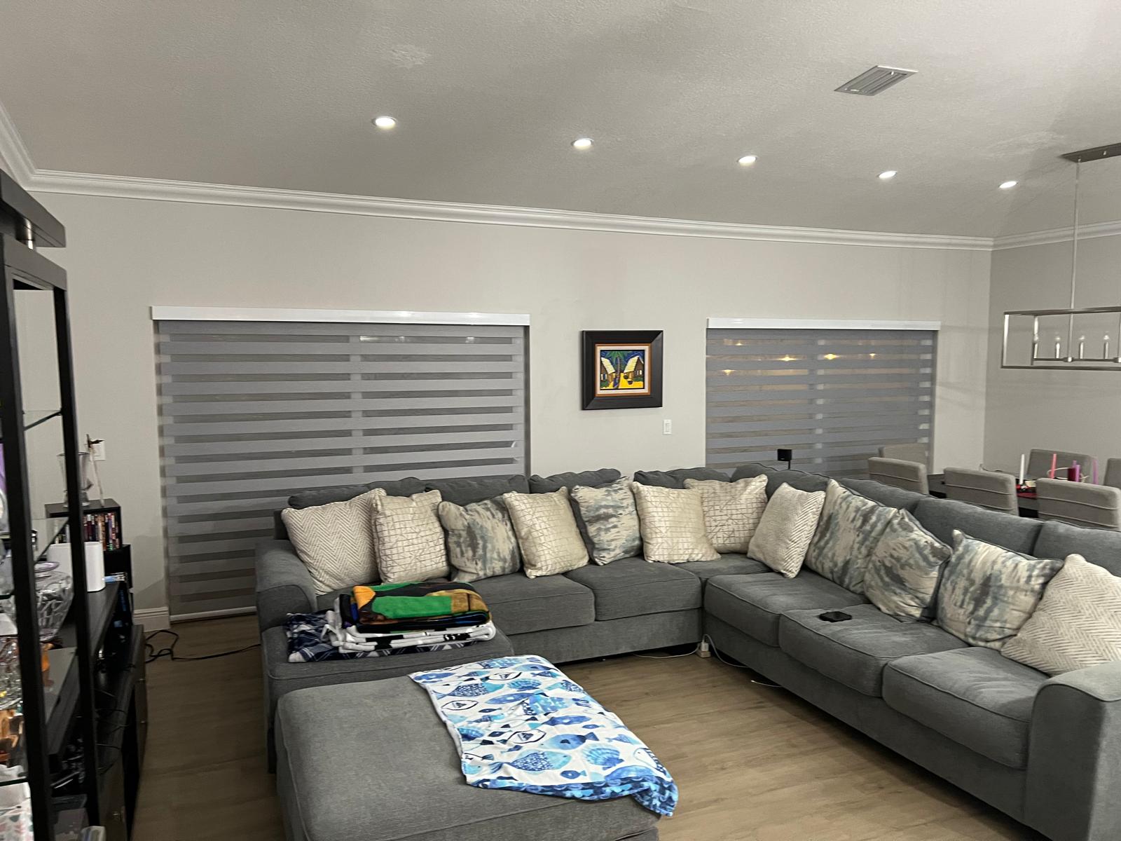 Custom gray zebra shades installed in a Miami living room